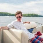 young man on pontoon boat RW3J27J
